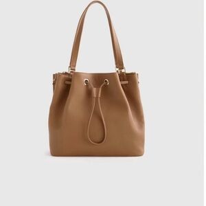 Chic Quince bucket handbag crafted in tan Italian leather.